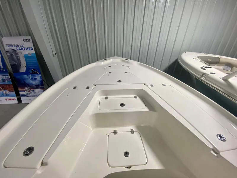 Slide: The Image of 2024 Key West 230 Bay Reef boat interior with storage compartments. - 18