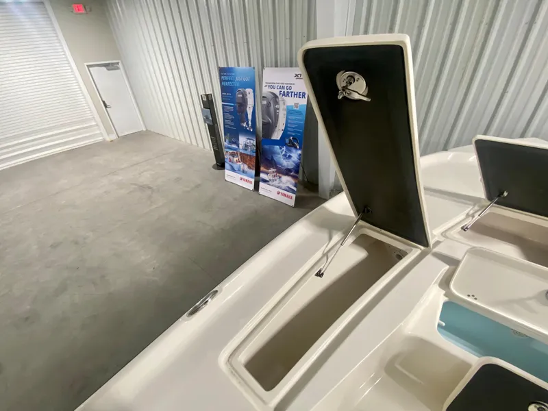 Slide: The Image of 2024 Key West 230 Bay Reef boat storage compartments in showroom. - 25