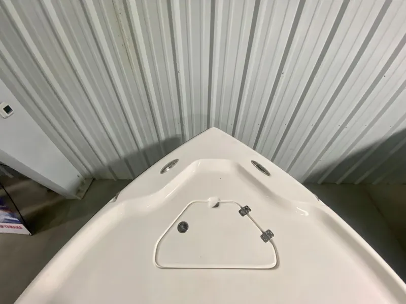 Slide: The Image of 2024 Key West 230 Bay Reef boat bow in storage. - 28