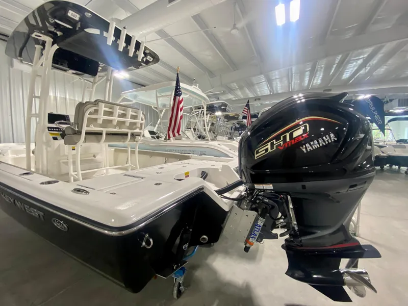 Slide: The Image of 2024 Key West 230 Bay Reef boat with Yamaha SHO engine in showroom. - 2