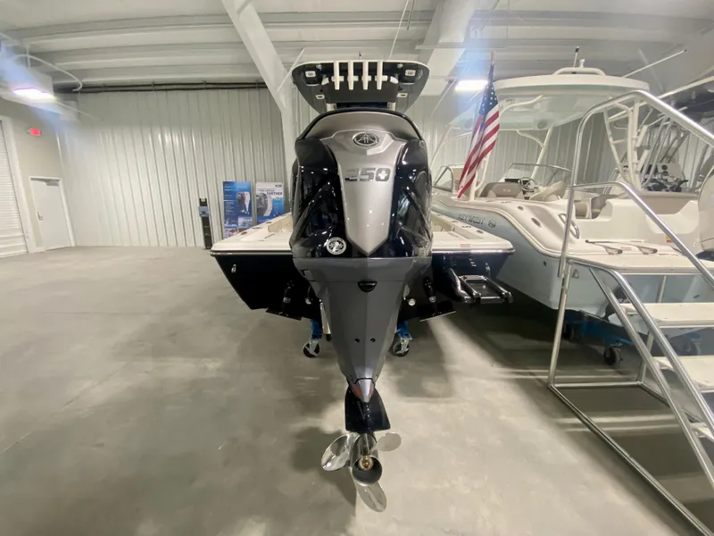 Slide: The Image of 2024 Key West 230 Bay Reef boat in showroom, rear view. - 3