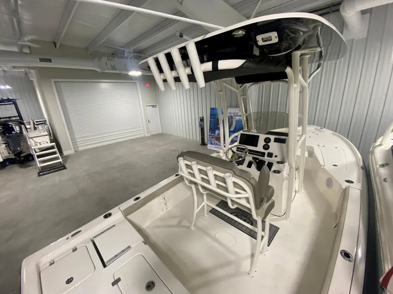 Slide: The Image of 2024 Key West 230 Bay Reef boat in a showroom. - 4