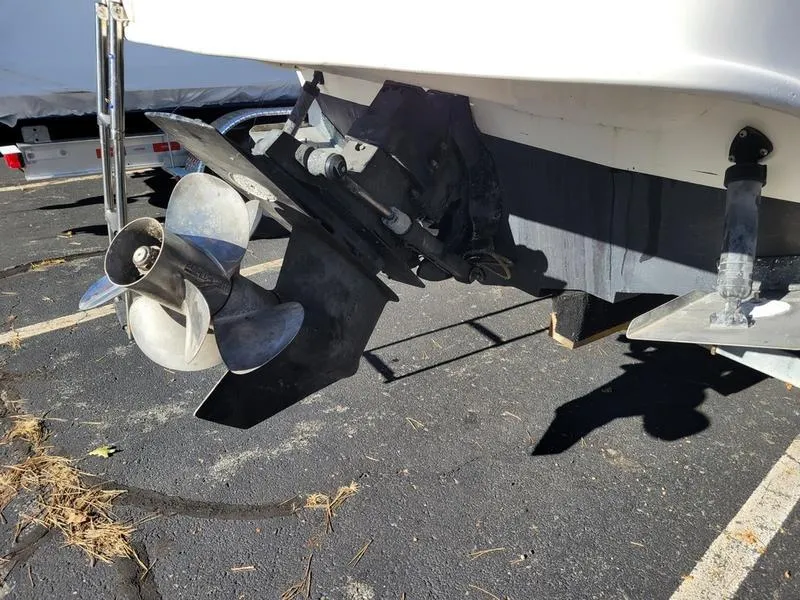 Slide: The Image of 2001 Sea Ray 26' Sundancer boat propeller and stern drive in parking lot. - 10