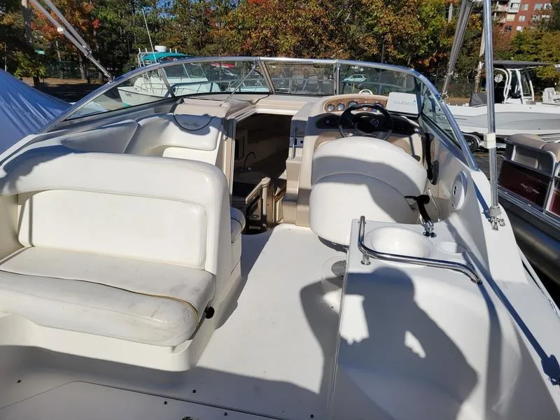 Slide: The Image of 2001 Sea Ray 26' Sundancer boat interior with seating and steering wheel. - 11