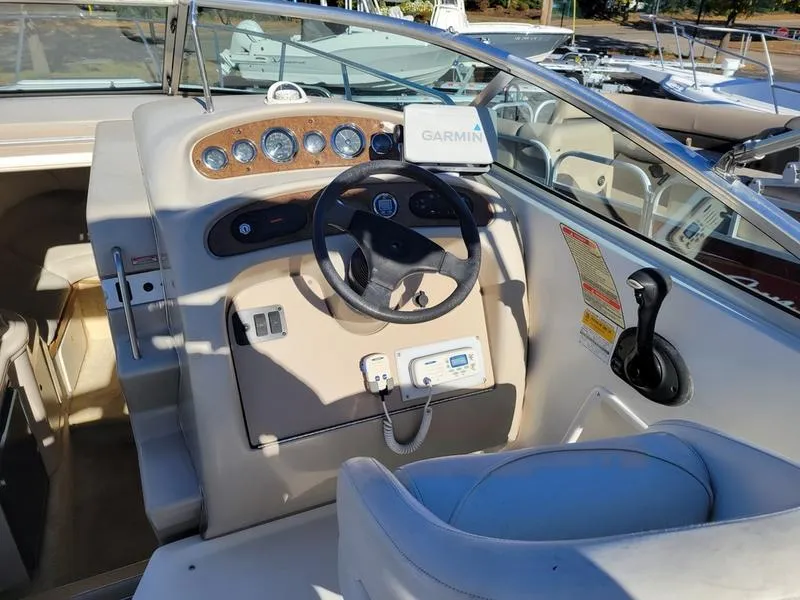 Slide: The Image of 2001 Sea Ray 26' Sundancer helm with Garmin navigation system. - 13