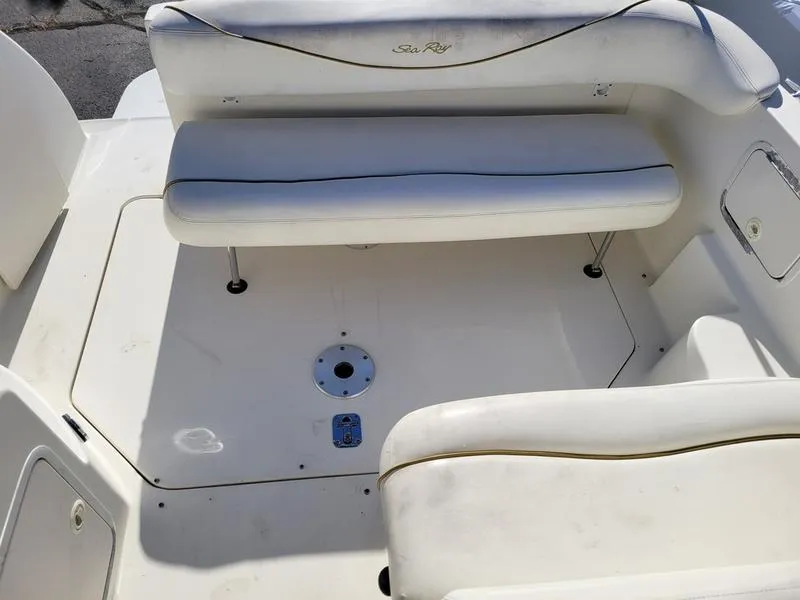 Slide: The Image of 2001 Sea Ray 26' Sundancer boat interior with white seating and deck area. - 14