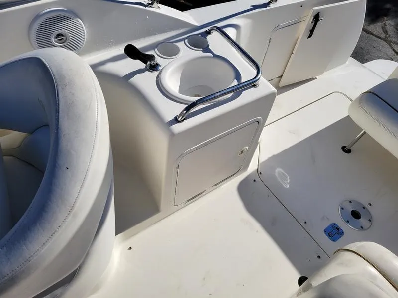Slide: The Image of 2001 Sea Ray 26' Sundancer boat interior with sink and seating area. - 16