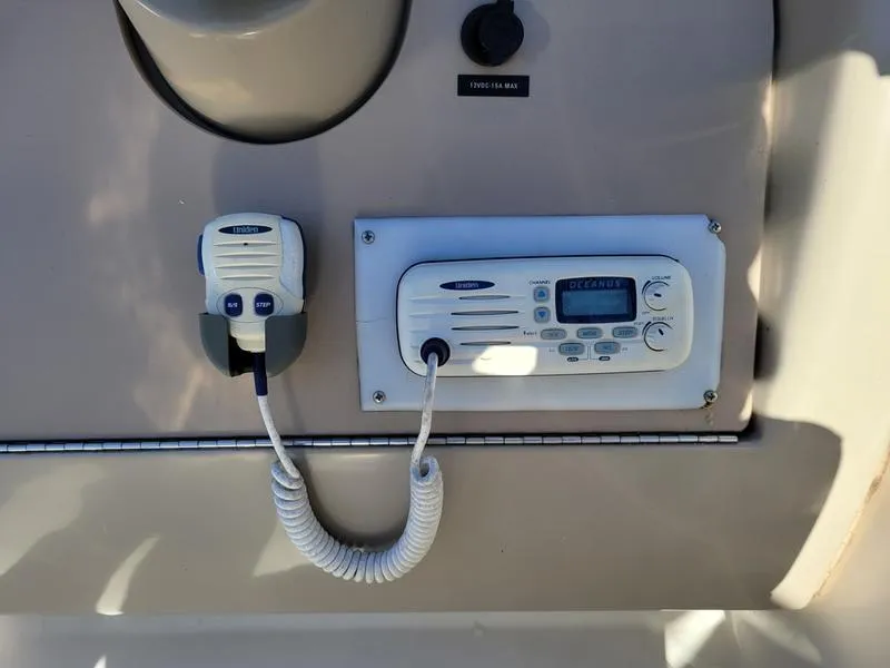 Slide: The Image of Marine radio system on 2001 Sea Ray 26' Sundancer boat dashboard. - 23