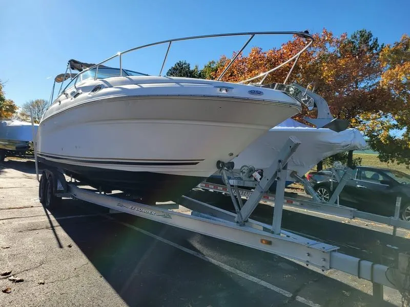 Slide: The Image of 2001 Sea Ray 26' Sundancer boat on trailer, parked outdoors in sunny weather. - 3