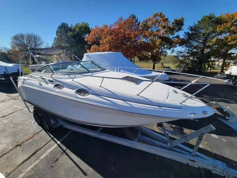 Slide: The Image of 2001 Sea Ray 26' Sundancer boat on trailer, parked outdoors. - 5