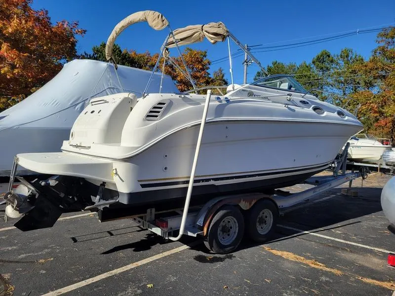 Slide: The Image of 2001 Sea Ray 26' Sundancer boat on trailer, parked outdoors. - 6