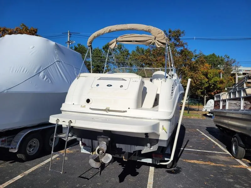 Slide: The Image of 2001 Sea Ray 26' Sundancer boat in parking lot, rear view. - 7