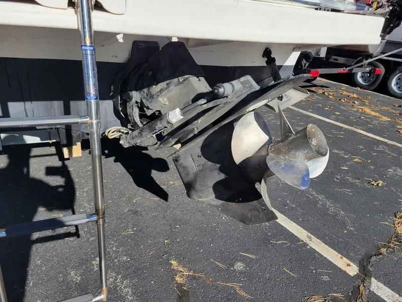 Slide: The Image of 2001 Sea Ray 26' Sundancer boat propeller and ladder in parking lot. - 9