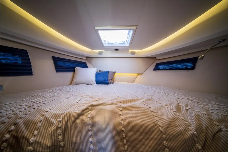 Slide: The Image of Luxurious bedroom interior of 2016 Nimbus 305 Coupe with skylight and ambient lighting. - 14