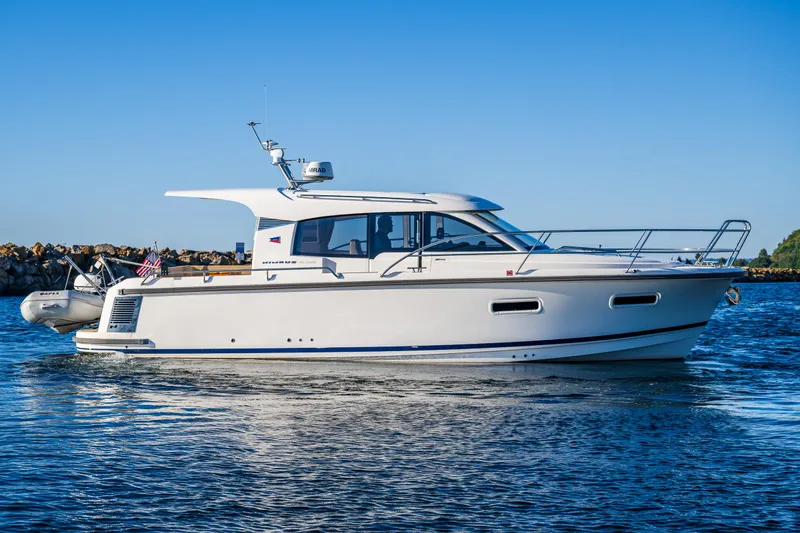Slide: The Image of 2016 Nimbus 305 Coupe cruising on calm waters. - 5