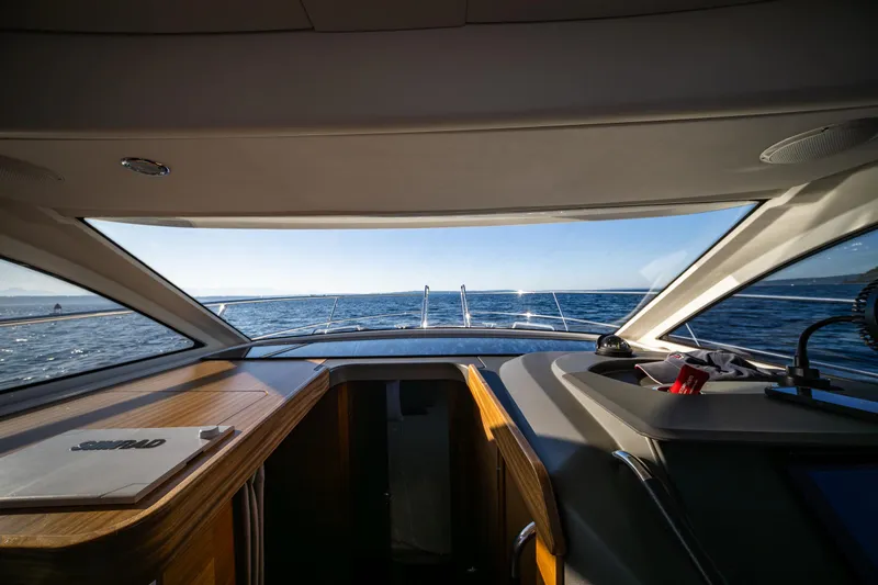 Slide: The Image of Interior view from the helm of a 2016 Nimbus 305 Coupe` yacht. - 9