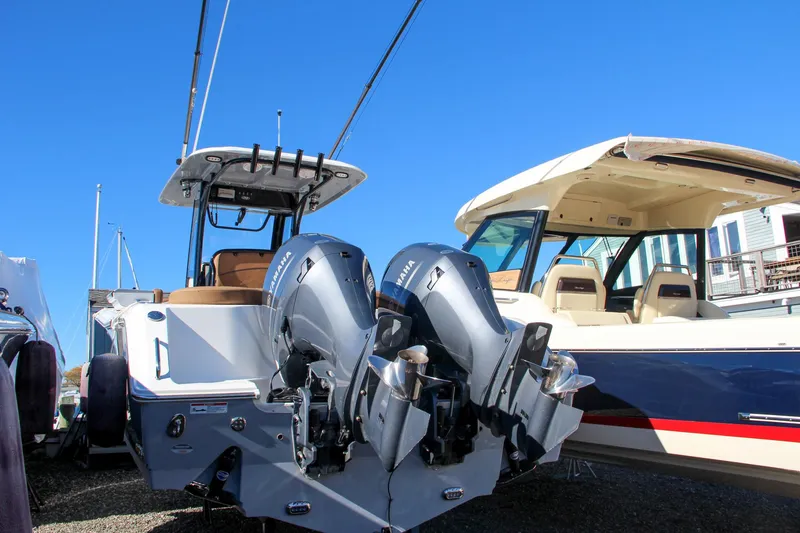 Slide: The Image of 2021 Sea Hunt Ultra 275 SE boat with dual outboard engines. - 12