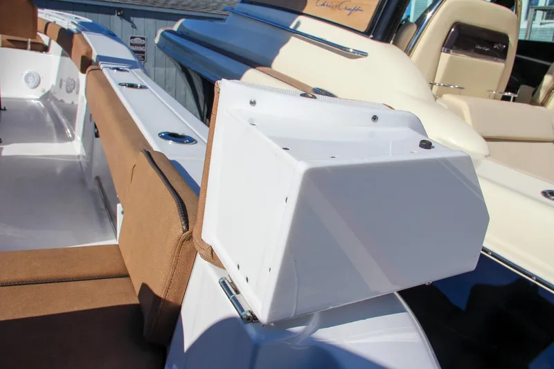 Slide: The Image of 2021 Sea Hunt Ultra 275 SE boat interior with seating and storage compartments. - 15