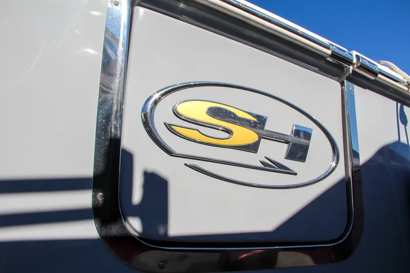 Slide: The Image of 2021 Sea Hunt Ultra 275 SE logo on boat exterior. - 2