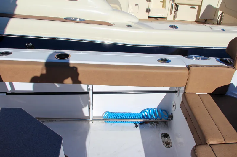 Slide: The Image of 2021 Sea Hunt Ultra 275 SE boat interior with seating and storage. - 20