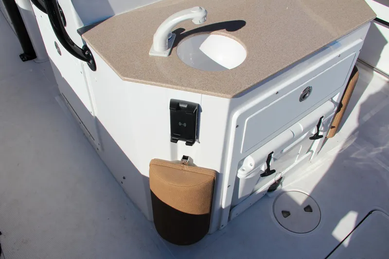 Slide: The Image of 2021 Sea Hunt Ultra 275 SE boat sink and storage area. - 24