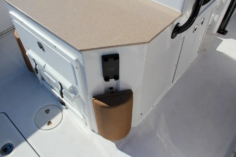 Slide: The Image of 2021 Sea Hunt Ultra 275 SE boat interior detail with storage compartments. - 25