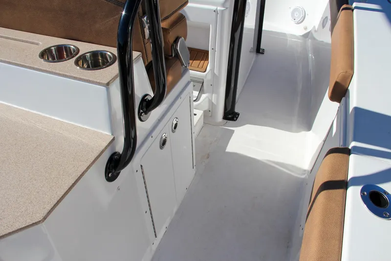 Slide: The Image of 2021 Sea Hunt Ultra 275 SE boat interior with seating and storage. - 34