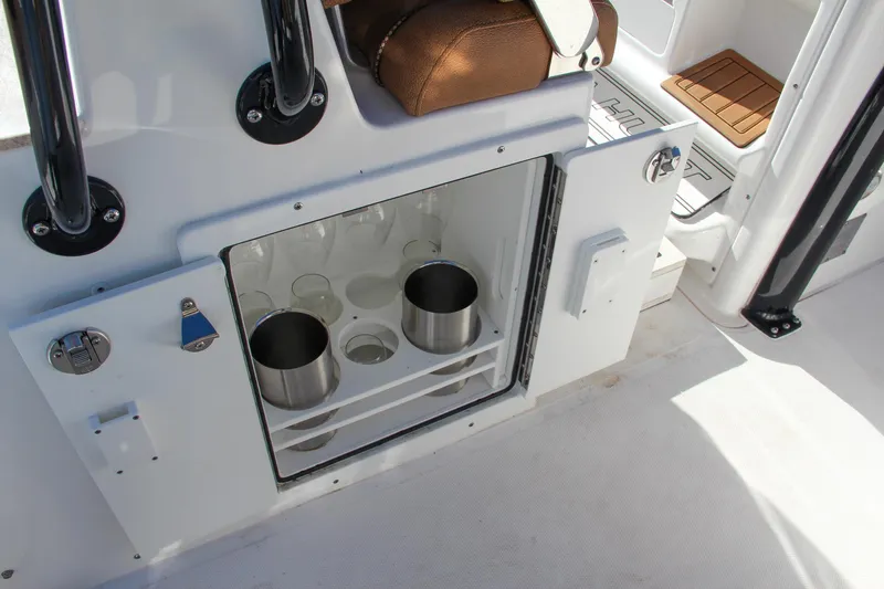 Slide: The Image of 2021 Sea Hunt Ultra 275 SE boat with open storage compartment. - 35