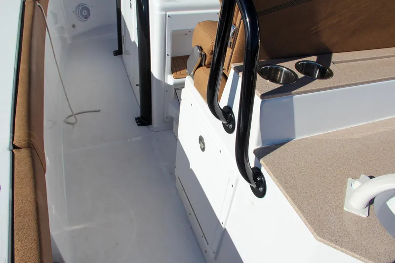 Slide: The Image of 2021 Sea Hunt Ultra 275 SE boat interior with seating and cup holders. - 38