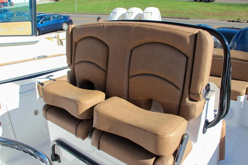 Slide: The Image of 2021 Sea Hunt Ultra 275 SE dual captain's chairs with brown upholstery. - 42