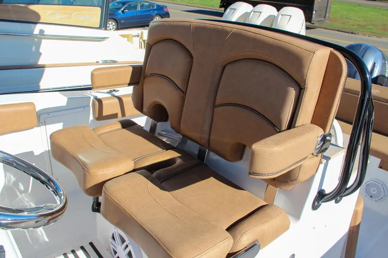 Slide: The Image of 2021 Sea Hunt Ultra 275 SE boat with tan cushioned seating. - 43