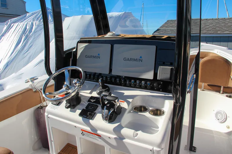 Slide: The Image of 2021 Sea Hunt Ultra 275 SE helm with Garmin navigation displays. - 44