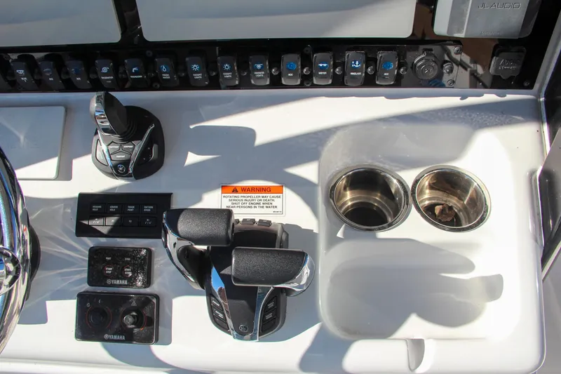 Slide: The Image of Control panel of 2021 Sea Hunt Ultra 275 SE boat with dual cup holders. - 47