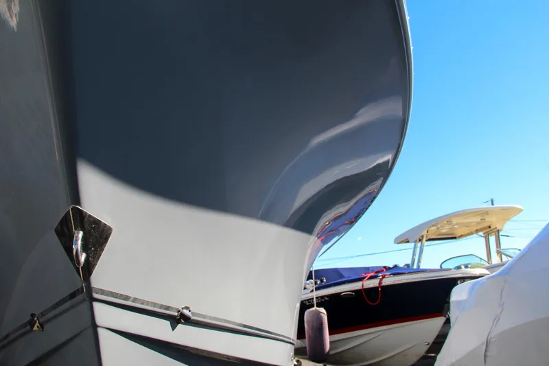 Slide: The Image of Close-up of 2021 Sea Hunt Ultra 275 SE boat hulls in a marina. - 6