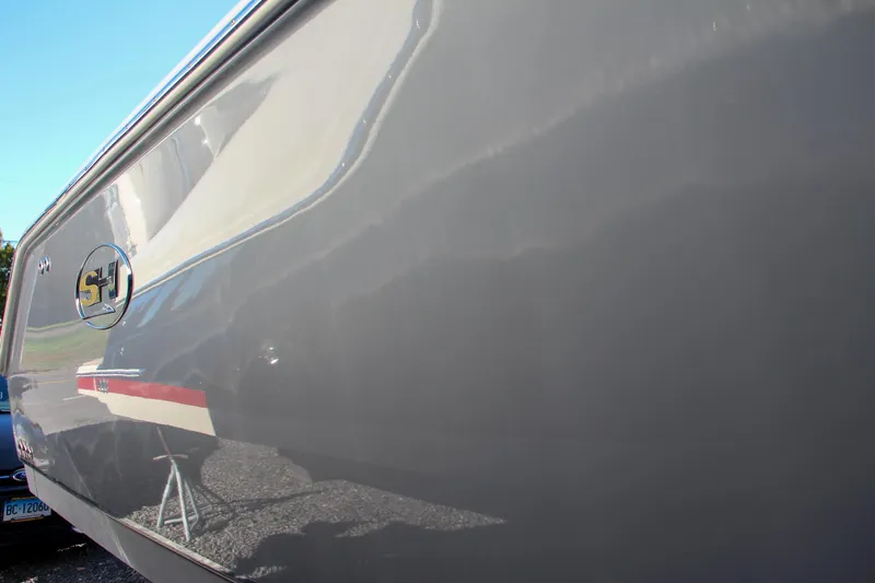 Slide: The Image of 2021 Sea Hunt Ultra 275 SE boat exterior close-up. - 7