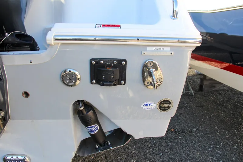Slide: The Image of 2021 Sea Hunt Ultra 275 SE boat stern with various fittings and connectors. - 9
