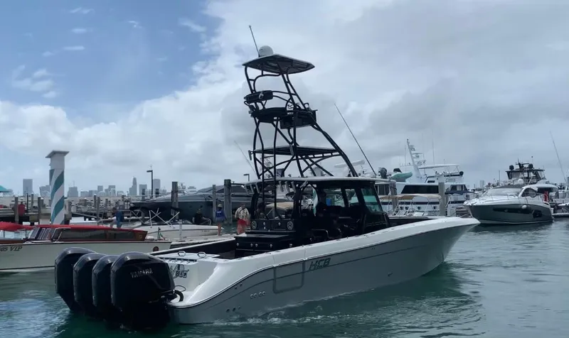 The Image of 2014 Hydra-Sports Siesta boat docked at a marina with multiple outboard engines. - 0