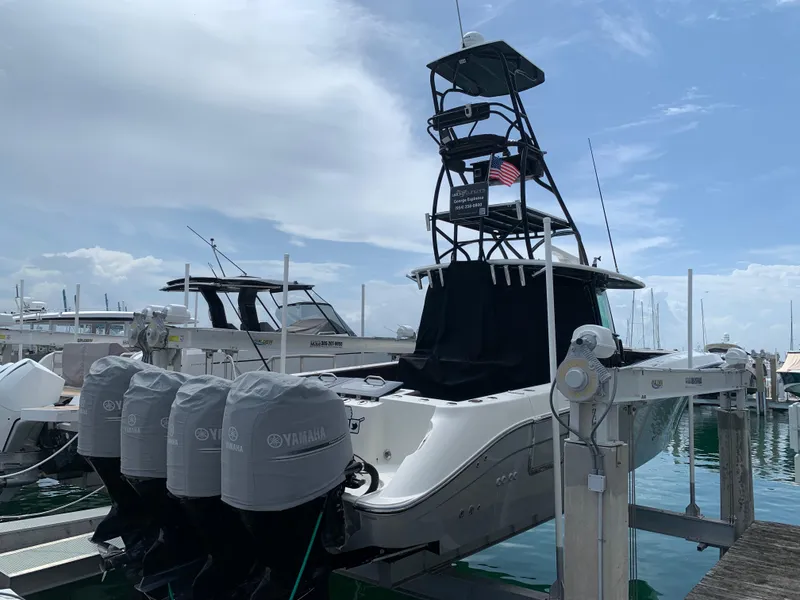 Slide: The Image of 2014 Hydra-Sports Siesta boat with Yamaha engines docked at marina. - 2