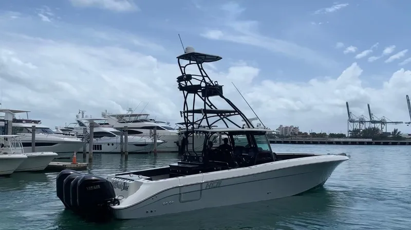 Slide: The Image of 2014 Hydra-Sports Siesta boat docked in a marina with other yachts. - 8