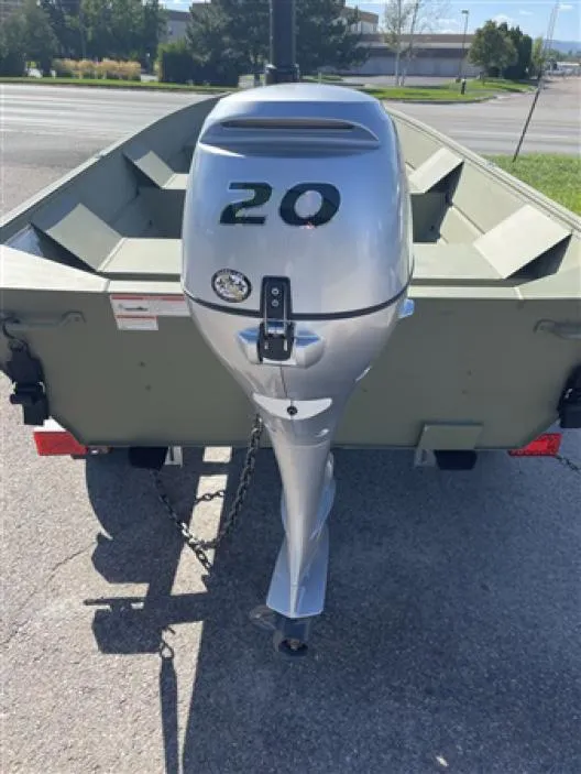 Slide: The Image of 2023 Klamath 13 Jac Wide boat with a 20 HP outboard motor. - 3