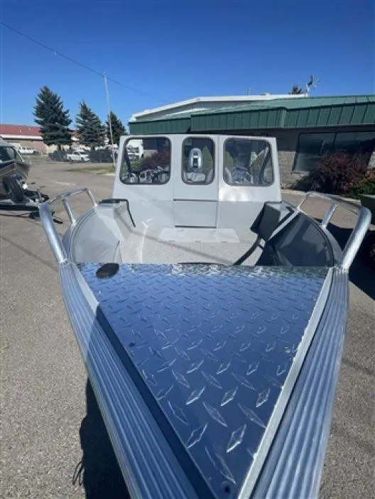 Slide: The Image of 2023 Klamath 18 Open Windshield boat with diamond plate deck. - 6