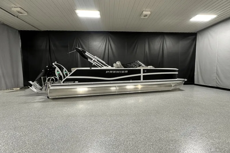 Slide: The Image of 2024 Premier 250 Solaris Sport pontoon boat in a showroom. - 0