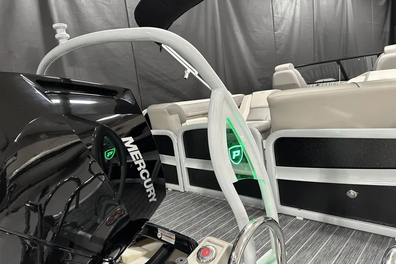 Slide: The Image of 2024 Premier 250 Solaris Sport boat interior with Mercury engine, modern design, and comfortable seating. - 11