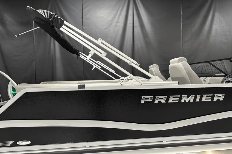 Slide: The Image of 2024 Premier 250 Solaris Sport boat with sleek black exterior and modern design. - 12