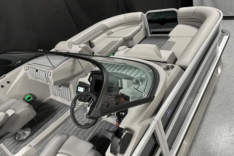 Slide: The Image of 2024 Premier 250 Solaris Sport boat interior with sleek seating and modern dashboard. - 15