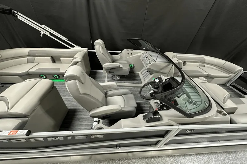 Slide: The Image of 2024 Premier 250 Solaris Sport pontoon boat interior with modern seating and sleek design. - 16