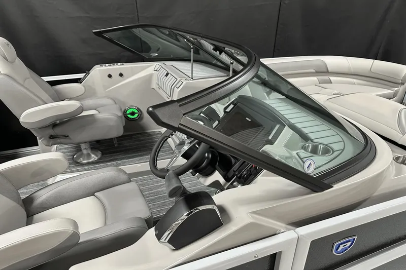 Slide: The Image of 2024 Premier 250 Solaris Sport boat interior with sleek design and modern dashboard. - 19