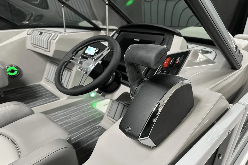 Slide: The Image of 2024 Premier 250 Solaris Sport boat interior with steering wheel and control panel. - 20