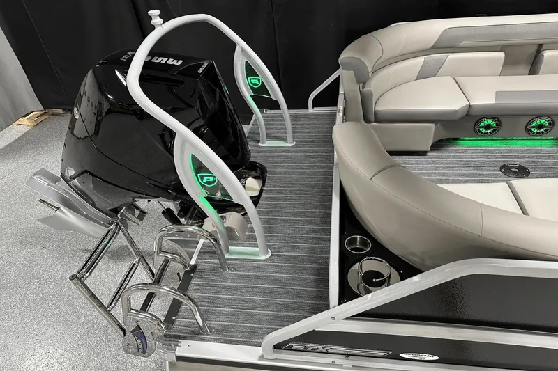 Slide: The Image of 2024 Premier 250 Solaris Sport boat interior with seating and outboard motor. - 22