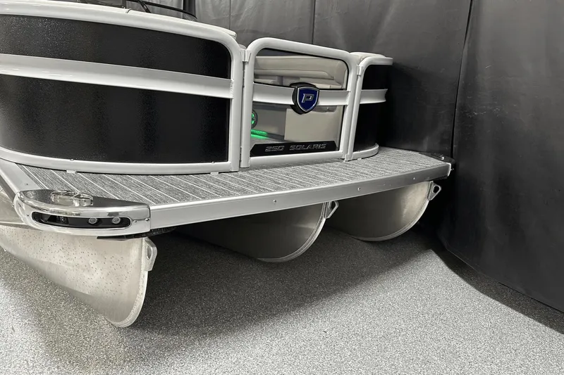 Slide: The Image of 2024 Premier 250 Solaris Sport pontoon boat, sleek design, black and silver finish. - 3